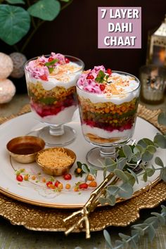 two layered desserts on a plate with flowers and greenery in the background text reads 7 layer dahi chaat