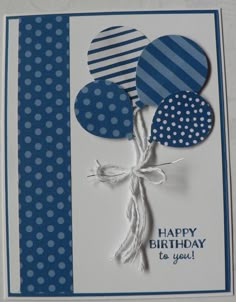 a blue and white birthday card with balloons