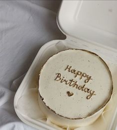 a birthday cake with the words happy birthday written in frosting on it sitting in a foam container