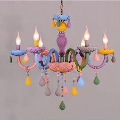 a chandelier with many different colored items hanging from it