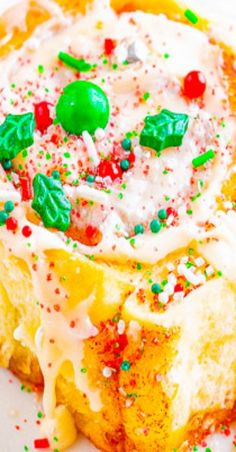 a close up of a pastry on a plate with sprinkles and candy