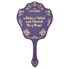 a purple paddle with the words make a wish and unlock the magic on it