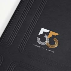 the logo for hudson yards is shown on a black book with gold trimmings