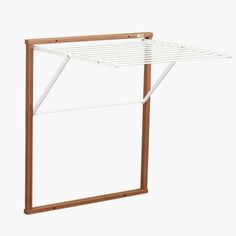 a wooden and white clothes drying rack