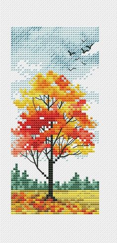 a cross stitch pattern with an orange tree in the foreground and a bird flying over it