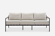 a black and white couch with four cushions