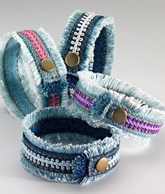 three bracelets are stacked together on top of each other, with zippers at the ends