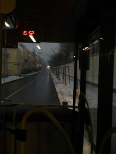 the inside of a bus on a snowy road