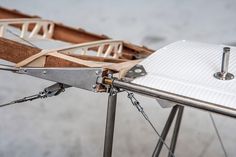 a close up view of the side of a wooden structure with metal brackets and screws