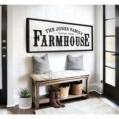 a bench with two baskets underneath it in front of a sign that says the jones family farmhouse