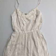 Lined With Really Beautiful Detailing Elegant Flowy Sundress With Lace Trim, Cream Sundress With Lace Trim, Flowy Lace Dresses For Day Out, Cream Midi Dress With Lace Trim For Day Out, Casual Dresses With Lace Trim And Spaghetti Straps, Spring Cream Dress With Lace Trim, Spring Cream Lined Dress, Spring Cream Dresses With Lace Trim, Cream Lace Sundress