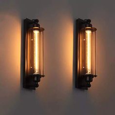 two lights are on the wall next to each other