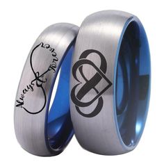 two wedding rings with the initials and names engraved on each ring, one is blue