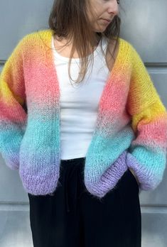 Rainbow cardigan is a hand knit mohair cardigan made of soft mohair yarn. Colorful hand knit cardigans and multicolored cardigans catch eyes of everyone as they are vibrant and rave. Gradient of this sweater is very unique and elegant. The chunky oversized cardigan design fit perfectly all body shapes and measurements. COLOR: in stock in FLAME, WATER, CANDY  Any other color available for custom orders. The knitting time is usually very short.  SIZE: perfect for S, M, L or XL The cardigan measure Crochet Cardigan Outfit, Gradient Sweater, Cardigan Colorful, Multicolor Cardigan, Hand Knit Cardigan, Rainbow Cardigan, Gradient Yarns, Sweater Chunky, Cardigan Design