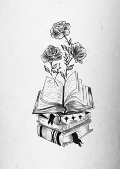 an open book sitting on top of a pile of books with flowers growing out of it