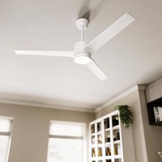 a white ceiling fan in a living room