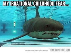 a shark swimming in the water with caption that reads, 3 this was always a major concern my national childhood fear