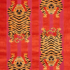 an orange and red rug with tigers on it