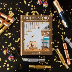 the book house story is surrounded by confetti and gold foiled streamers