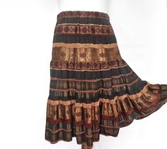 Vintage skirt with 3 layers of beautiful brocade-style fabric in bronze and brown. Elastic in the waist that can be stretched up to 96cm / 37.7 inches in circumference. Size L to XL. Very good condition. Length of the skirt is 78 cm / 30.7 in inches.  waist 82 cm / 32.3 in inches. P.S. Take in consideration that these clothes are not brand new. It's used so do not expect a perfect brand new condition. Support Zero Waste movement buying this item and extending it's life. Brown Long Skirt For Festival, Traditional Long Brown Skirt, Festival Long Brown Skirt, Bohemian Brown Flared Skirt, Brown Ruffled Flared Skirt, Brown Lined Tiered Skirt, Brown Tiered Lined Skirt, Brown Flowy Bohemian Skirt, Brown Gathered Long Skirt