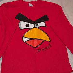 a red shirt with an angry bird on it