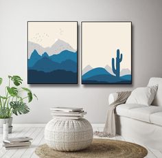 two paintings on the wall in a living room