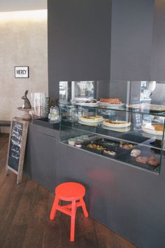 a display case in a bakery filled with lots of food