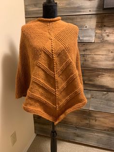 This lovely lady's poncho is fashionably light weight. It is perfect for work or a night out, cool spring days and summer nights around the campfire. A beautiful light-colour burnt orange yarn make it the perfect find.  It is made with a blended yarn and can be washed in cold water (lay flat to dry).  It measures 26 inches from neck to wrist. One Size Cape Shawl For Fall, One Size Fall Cape Shawl, Fall Cape Shawl One Size, One Size Acrylic Poncho Shawl, Acrylic Poncho Shawl For Fall, Acrylic Shawl Poncho For Fall, One Size Acrylic Poncho For Fall, One Size Knit Shawl For Fall, One Size Soft Knit Poncho For Fall