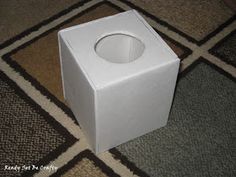 an empty white box sitting on the floor