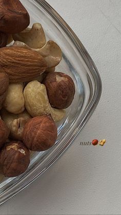 a bowl filled with nuts on top of a table