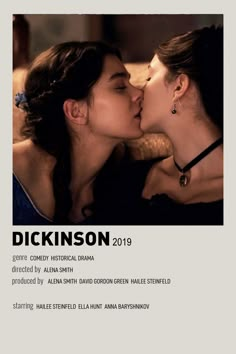 two women kissing each other in front of a poster for the film, dickinson