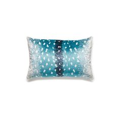 a blue and white pillow on a white background