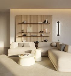 a living room filled with white furniture and shelves