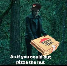 a man carrying a pizza box in the woods with an ad on it that reads, as if you could out pizza the hut