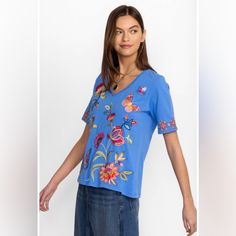 Nwt Johnny Was Gracey Trapunto Vneck Tshirt Small Crafted From 100% Breathable Cotton, The Gracey Trapunto V-Neck T-Shirt Is A Fresh Twist On A Closet Staple. Featuring A V-Neckline, And Colorful Placement Embroidery, This Tee Offers Short Sleeves And A Relaxed Fit For Everyday Comfort. Pair With Linen Shorts And Leather Sandals For A Weekend Of Vacation Sightseeing. 100% Cotton Model Height: 5'11 1/2" Model Is Wearing A Size Small Measurements For Size Medium: Bust - 42", Length - 26 1/2" Care Instructions: Machine Wash Cold Only. Non-Chlorine Bleach When Needed. Tumble Dry Low. Warm Iron. Sku: J13224-2:Ulm:Xl Y08 Casual Blue V-neck T-shirt, Casual Blue Short Sleeve V-neck Top, Blue V-neck T-shirt For Spring, Blue Cotton V-neck T-shirt, Placement Embroidery, Closet Staples, Linen Shorts, Johnny Was, Model Height