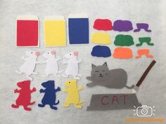 cut out felt animals and cat shapes on a white background with the word cat written below them