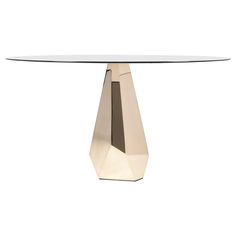 a white table with a gold base and glass top on an isolated white background for use as a dining room or office space