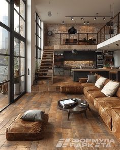 a living room filled with lots of furniture and large windows next to a staircase leading up to a loft