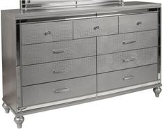 a silver dresser with many drawers on it