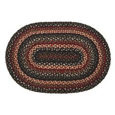 a black, red and white oval rug on a white background with an oval design in the center