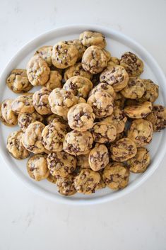 a plate full of chocolate chip cookies on a table