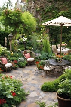 an outdoor patio with chairs, tables and umbrellas in the middle of it is surrounded by greenery