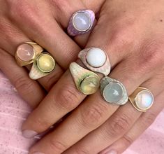 Inspired by the Hawaiian sunsets, this Mood ring was designed capture that magical moment when the sun sets on the water. Four juicy gemstone colors to choose from: White Onyx, Chalcedony, Aqua Marine & Prehnite. Each ring is one-of-a-kind & handmade with love. The color palettes are custom made to compliment each gemstone. Not captured in these images is how the ring winks at you as you move. Orb like dreamie. We believe in magic. Olympic Jewelry, Summer Rings, White Onyx, Mood Ring, Golden Ring, Setting Sun, Resin Ring, Aqua Marine, Emerald Earrings