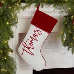 a christmas stocking hanging from a fireplace mantel