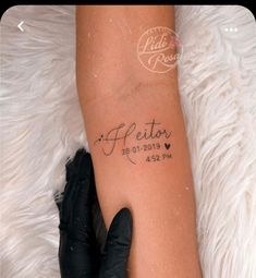 a woman's arm with a tattoo on it that reads, felicary