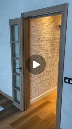 an open door leading into a room with wood floors