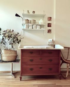 a bathroom with a sink and wooden furniture