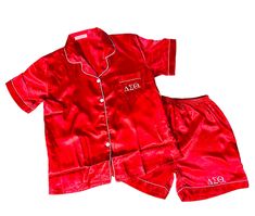 Our Delta Sigma Theta Satin Pajama Short Set is made from silky soft satin and is the perfect sorority gift.  The set includes a pajama shirt and shorts. Short sleeve pajama shirt with pocket. Above the knee length shorts.  DETAILS: - Each pajama set is carefully customized with Delta's Greek Letters. - Contrast Piping - Shorts come with an elasticated waist, drawstrings, and one pocket - Flattering neckline and cute collar - Soft satin fabric that looks and feels both rich and luxurious - Comfortable and relaxed fit SIZE GUIDE: US Sizing: We offer the following sizes: - Adult Sizes - Extra Small (XS), Small (S), Medium (M), Large (L), and Extra Large (XL), - Plus Sizes - 1X, 2X and 3X Please see the size chart and order accordingly. You will need to mention the PJ size in the Personalizat Casual Satin Sets For Pajama Party, Satin Sleepover Set With Short Sleeves, Satin Short Sleeve Sleepover Sets, Short Sleeve Satin Sets For Home, Satin Sets With Short Sleeves For Home, Red Silk Pajamas, Sorority Pajamas, Silk Pj Set, Red Pajamas