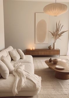 a living room with a white couch and coffee table