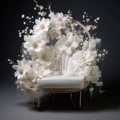 a chair with white flowers on it sitting in front of a black background